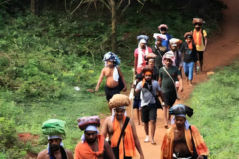 Pilgrims Trek Through Forested Satram Pulmedu Route to Reach Sabarimala Temple